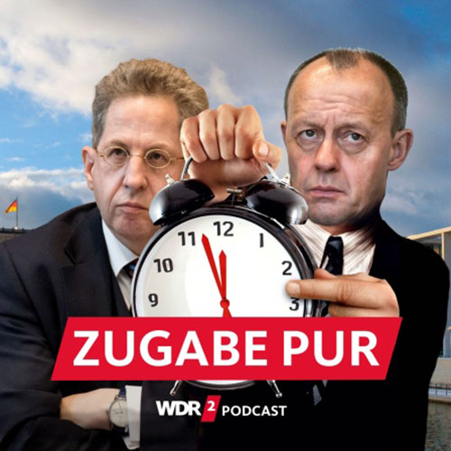 Satirische Fotomontage: Friedrich Merz und Hans-Georg Maaßen vor dem Spreebogen, Merz hält einen großen Wecker in der Hand, dessen Zeiger "kurz vor 12
